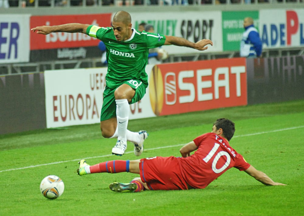 Yaniv KAtan of Maccabi and Cristian Tanase (R) of FCSB pictured in action during UEFA Europa League Group J game between FCSB and Maccabi Haifa at National Arena.