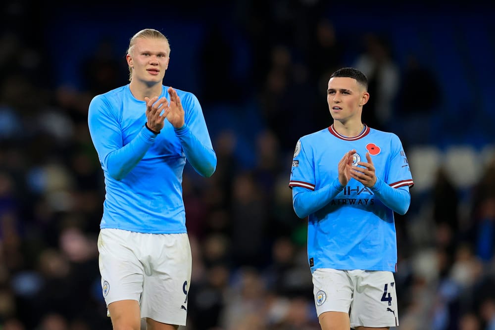 Erling Haaland #9 and Phil Foden #47 of Manchester City celebrate the 2-1 victory at the end of the Premier League match Manchester City vs Fulham