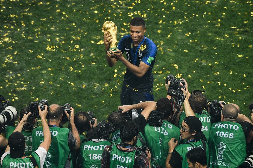 ChinaImages, Depositphotos.com, Kylian Mbappe of France poses with the World Cup trophy.