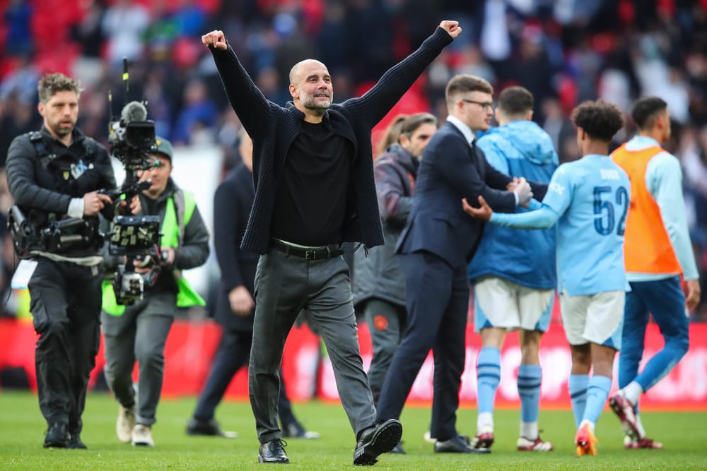 Pep Guardiola manager of Manchester City celebrates.