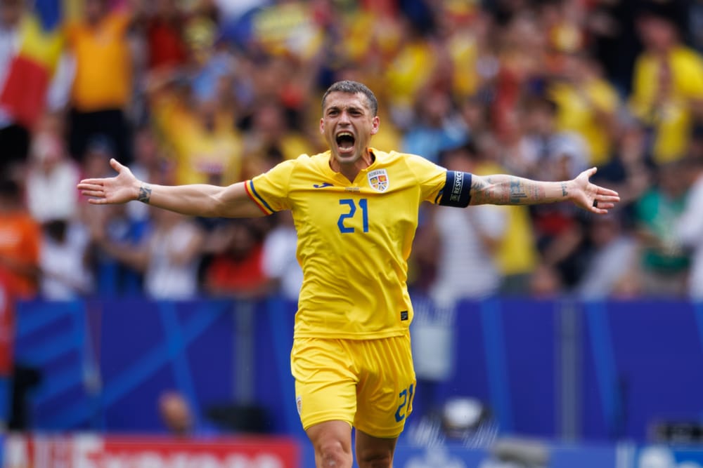 Nicolae Stanciu celebrates after scoring goal during UEFA Euro 2024 game between national teams of Romania and Ukraine at Allianz Arena, Munich, Germany.